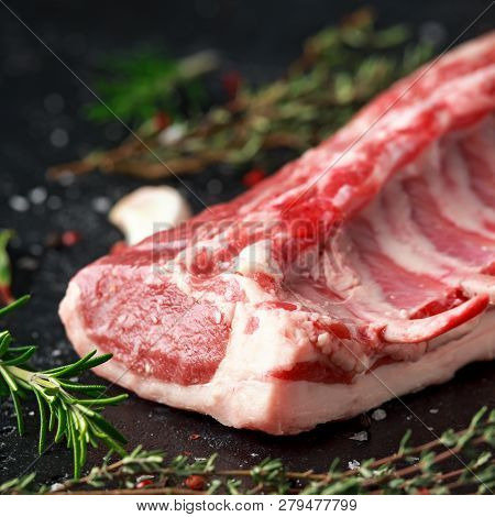 Raw Fresh Rack Of Lamb With Green Herbs.