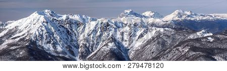 Beautiful Snowy Caucasus Mountain Peaks. Scenic Winter Panoramic Landscape In Krasnaya Polyana, Soch
