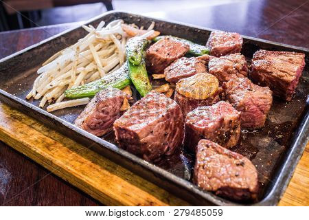 Beef Steak Served On A Sizzling Iron Plate