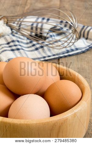 Chicken Eggs In Wood Basket Or Wood Bowl