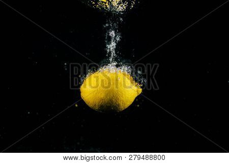 Image Of Large Fresh Lemon Falls In Water