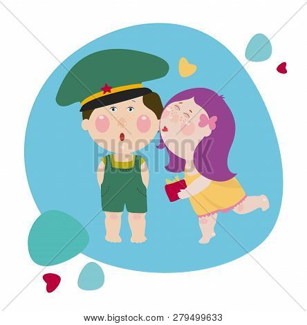 Girl Kisses A Boy And Gives A Present To Him. Girl Congrats A Boy In The Military Uniform. Cute Chil