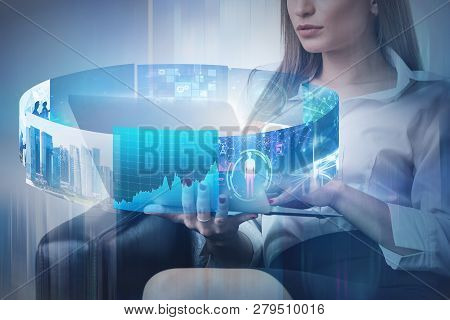 Unrecognizable Businesswoman With Blond Hair Sitting In Armchair With Laptop With Immersive Business