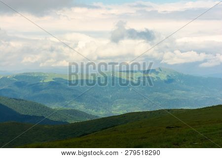 Distant Mountain Ridge In Clouds. Beautiful Summer Landscape With Cloudy Weather