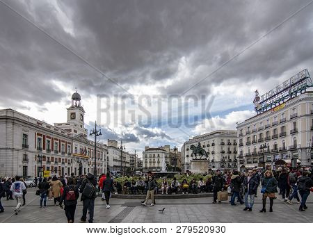 Tourists In The Square Of  Puerta Del Sol In The Historic Center Of Madrid