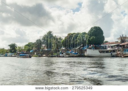 Oiapoque, Brazil - August 1, 2015: Small Boats On Oiapok Oiapoque Or Oyapock River In Oiapoque Town.