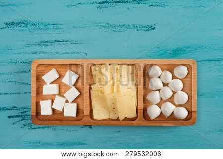 Cheese Compartmental Dish With Different Cheeses, On Rustic Wooden Background.