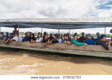 Napo, Ecuador - July 7, 2015: Passengers Of A Boat Traveling A River Napo Stretch Coca-nuevo Rocafue