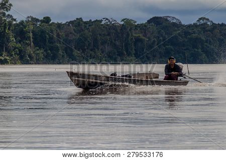 Nuevo Rocafuerte, Ecuador - July 9, 2015: Villager On A Dugout Canoe Called Peke Peke On A River Nap