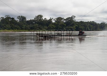 Nuevo Rocafuerte, Ecuador - July 9, 2015: Villager On A Dugout Canoe Called Peke Peke On A River Nap