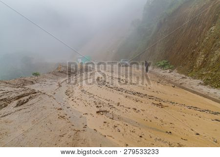 Vilcabamba, Ecuador - June 15, 2015: Mud Is Flowing On The Road As A Result Of Landslide. Road Zumba
