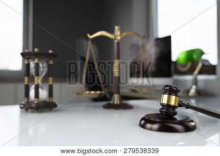Lawyers Office. Gavel, Scale And Computer On The White Table.