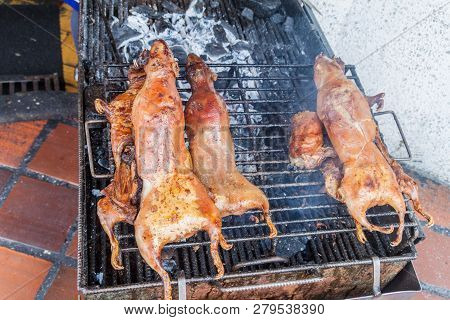 Roasted Guinea Pigs On A Market In Banos De Agua Santa, Popular Tourist Destination In Ecuador