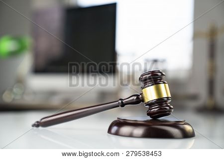 Lawyers Office. Gavel And Computer On The White Table.