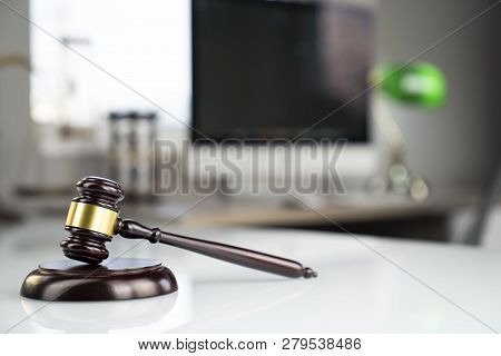 Lawyers Office. Gavel And Computer On The White Table.
Lawyers Office. Gavel, Scale And Computer On 