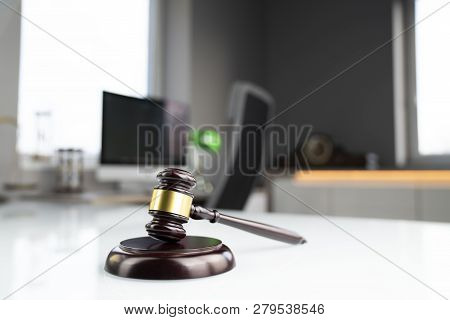 Lawyers Office. Gavel And Computer On The White Table.