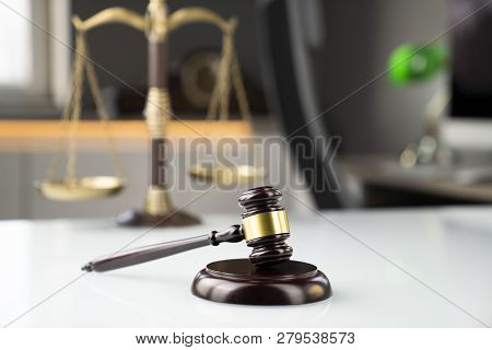 Lawyers Office. Gavel And Scale  On The White Table.