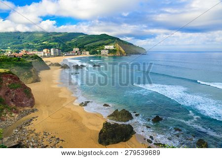 Beautiful Sandy Beach With Good Waves For Surfing In Bakio, Basque Country, Spain In Sunny Day