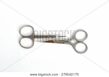 2 Types Of Small Steel Nail Scissors On White Background.