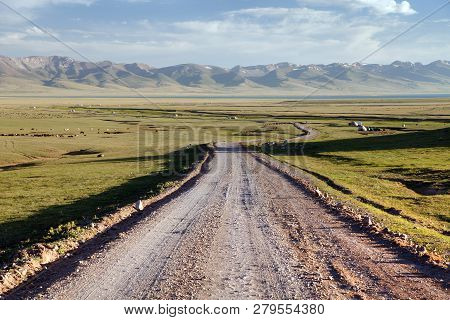 Unpaved Road And Yurts Near Son-kul Lake And Tien Shan Mountains In Kyrgyzstan