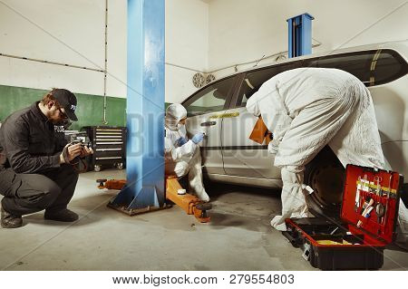 Crime Scene Investigation - Inspection Of Suspected Car In Police Garage