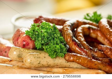 German Sausages With Garnish. Delicious German Sausages With Parsley.