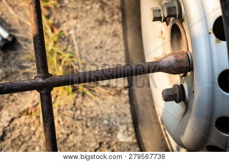 Fixing Car Tire With Rim Socket Wrench