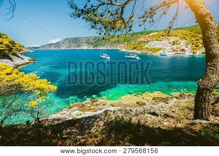 Cozy Turquoise Bay Close To Assos Village, Kefalonia. Greece. White Sail Boats In Beautiful Emerald 