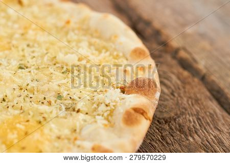 Pizza Crust, Cheese Pizza Basis Macro. Close Up Baked Pizza On Wooden Table.