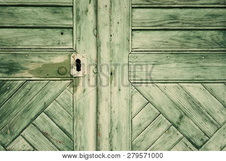 Green Painted Wood Door Background With Keyhole