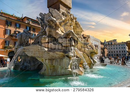 Rome, Italy - September 30 2018: Tourists Visit The Fountain Of The Four Rivers By Bernini In The Pi