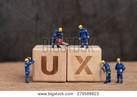 User Experience Design In Product And Service Concept, Miniature People Workers With Blue Team Unifo
