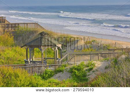 The beach in Corolla on the Outer Banks is a popular vacation destination in North Carolina.  Boardwalks and gazebos are offer access to the ocean.