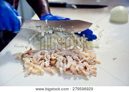 Close up of Bahamian man preparing conch for  salad