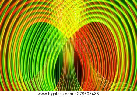 Abstract Rainbow Neon Glowing Crossing Lines Pattern. Dark  Background Of Colorful Neon Yellow, Orab