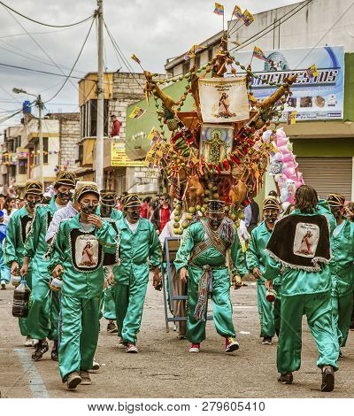 Latacunga, Ecuador - September 22, 2018 - The Strongest Men Of Each Neighborhood Carries A Pig And A