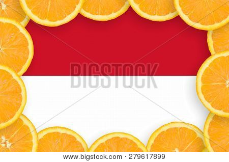 Indonesia Flag  In Fresh Citrus Fruit Slices Frame