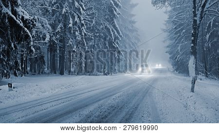 Snowy Winter Road With Car. Dangerous Car Driving In The Mountains In The Winter. Concept For Transp