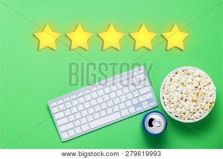 Bowl Of Popcorn, A Can Of Drink, A Keyboard On A Green Background. Added Five Stars Rating. Reputati