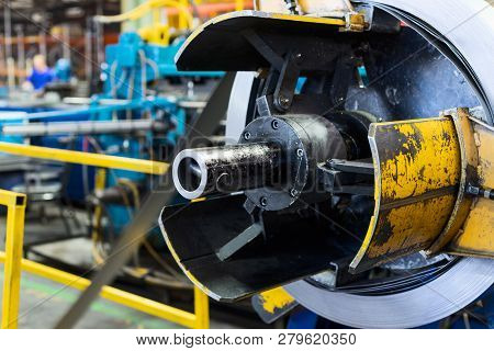 Empty Decoiler Of Machine In Metalwork Manufacturing. Modern Equipment For Sheet Metal Processing.