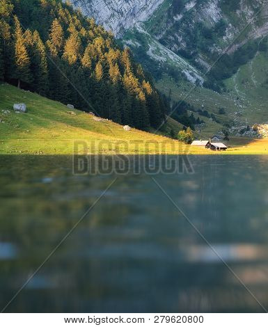 Landscape In The Switzerland. Mountains And Lake. Reflection On The Water Surface. Natural Lndscape 