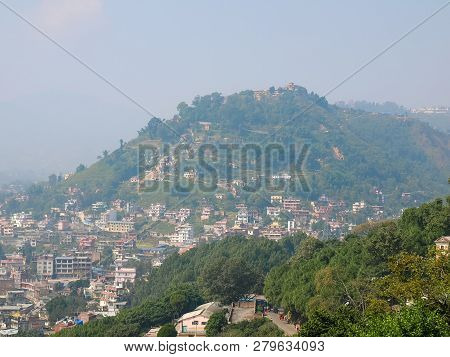 Western Surroundings Of Kathmandu. View From Viewpoint Of Swayambhu Hill To Neighboring Hillock, Nep
