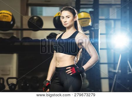 Young Athletic Woman In Sport Outfit