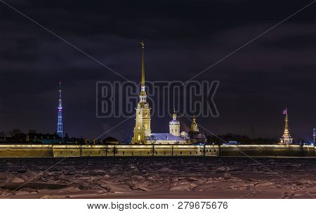 Night View From The Embankment Of Neva River To The Peter And Paul Fortress Located On Zayachy Islan