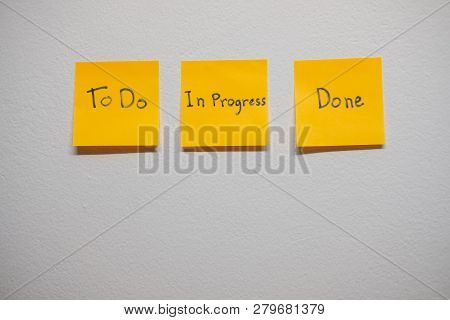 Monitor Task Of Work Concept, To Do, In Progress, Done Note Reminder Yellow Sticker Or Post Note On 