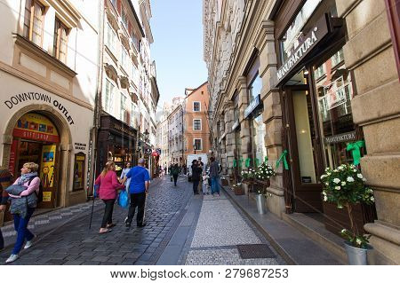 Prague, Czech Republic - June 7, 2017: Tourists Pass By Shops And Cafes In A Picturesque Section Of 