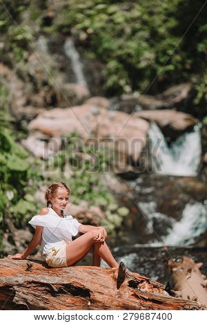 Little Girl Enjoying View Of Waterfall In Krasnay Poliana