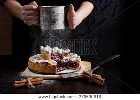 Baked American сherry Pie With Powdered Sugar In The Kitchen At Home