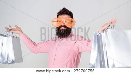 Man Bearded Hipster With Lot Shopping Bags. Shopping On Black Friday. Happy Shopping With Bunch Pape