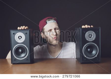 Young Man Audiophile Listen To Loud Music From Speakers